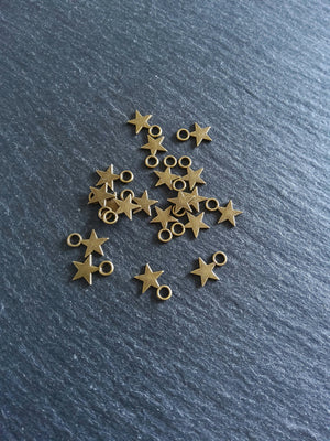40 or 200 Small Star Charms Antique Bronze Tone 11x8mm