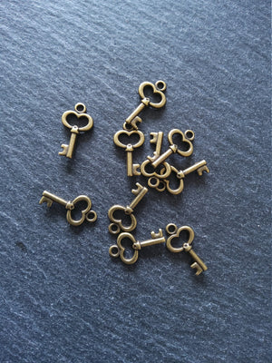 20 or 100 Cute Little Key Charms Antique Bronze Tone 15x9mm 2.5mm wide. Nickel FREE