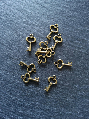 20 or 100 Cute Little Key Charms Antique Bronze Tone 15x9mm 2.5mm wide. Nickel FREE