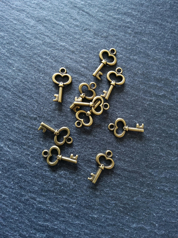 20 or 100 Cute Little Key Charms Antique Bronze Tone 15x9mm 2.5mm wide. Nickel FREE
