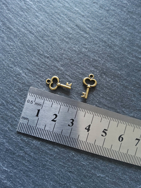 20 or 100 Cute Little Key Charms Antique Bronze Tone 15x9mm 2.5mm wide. Nickel FREE