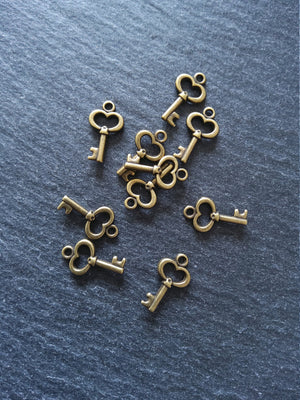 20 or 100 Cute Little Key Charms Antique Bronze Tone 15x9mm 2.5mm wide. Nickel FREE