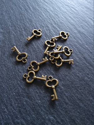 20 or 100 Cute Little Key Charms Antique Bronze Tone 15x9mm 2.5mm wide. Nickel FREE