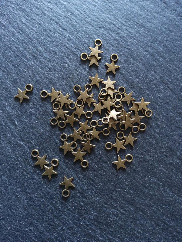 40 or 200 Small Star Charms Antique Bronze Tone 11x8mm