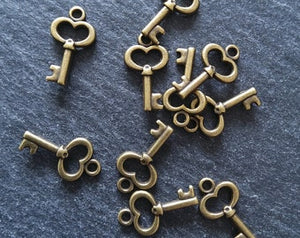 20 or 100 Cute Little Key Charms Antique Bronze Tone 15x9mm 2.5mm wide. Nickel FREE
