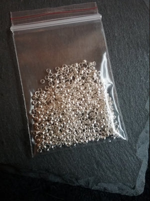 Approx. 500 (7g) pack of 2mm Crimp Beads in Gold or Silver Plated, Antique Silver Tone, Antique Bronze or Antique Copper Tone Hole: 1.2mm