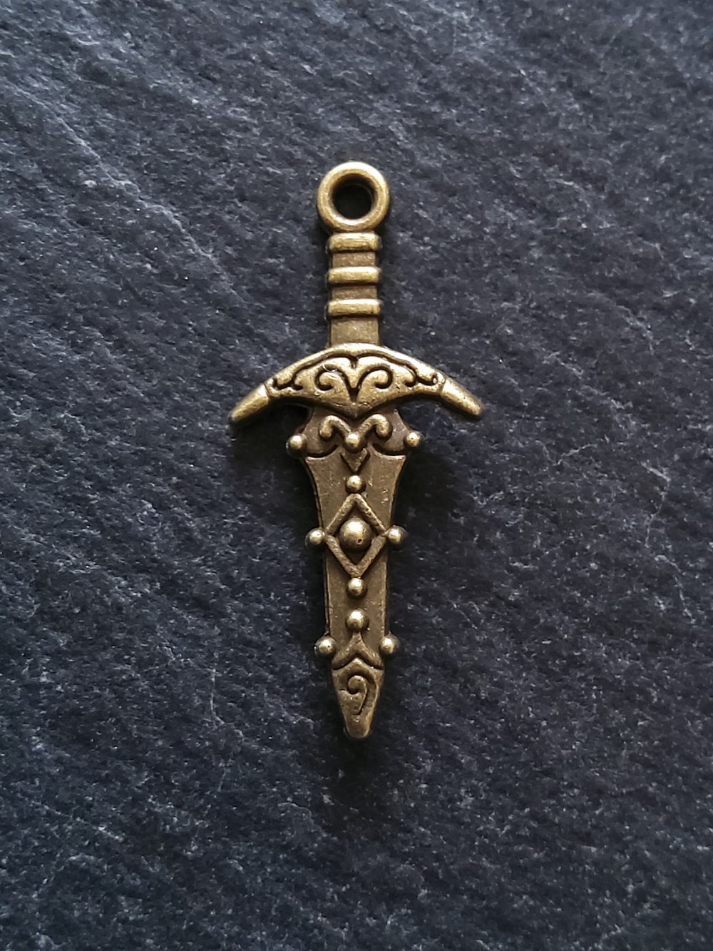 10 or 50 Sword Charms Antique Bronze Tone Metal Alloy 28x13mm