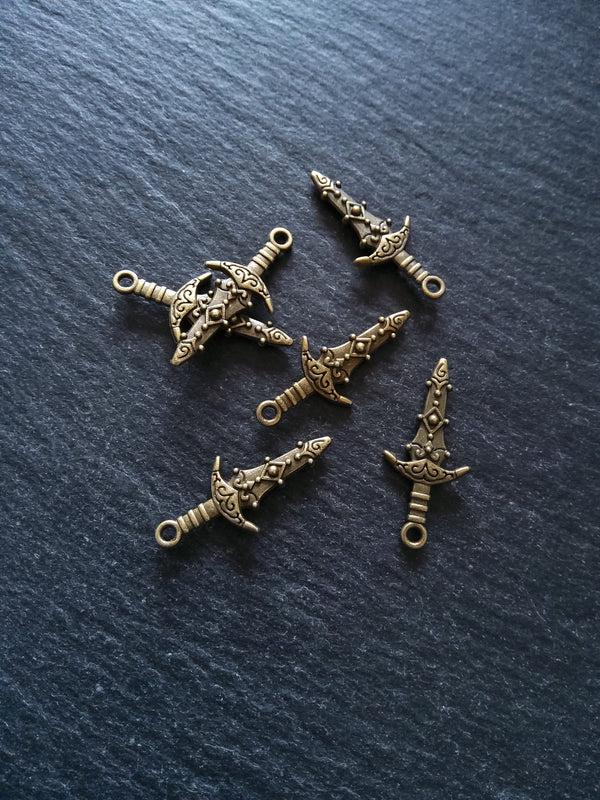 10 or 50 Sword Charms Antique Bronze Tone Metal Alloy 28x13mm
