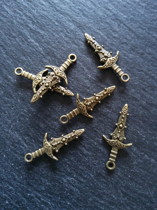 10 or 50 Sword Charms Antique Bronze Tone Metal Alloy 28x13mm