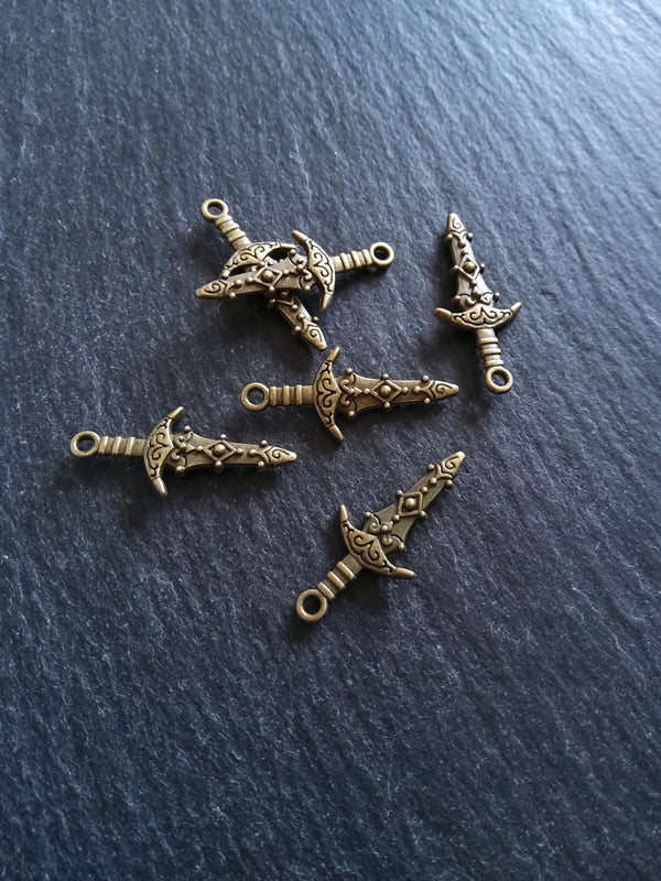 10 or 50 Sword Charms Antique Bronze Tone Metal Alloy 28x13mm