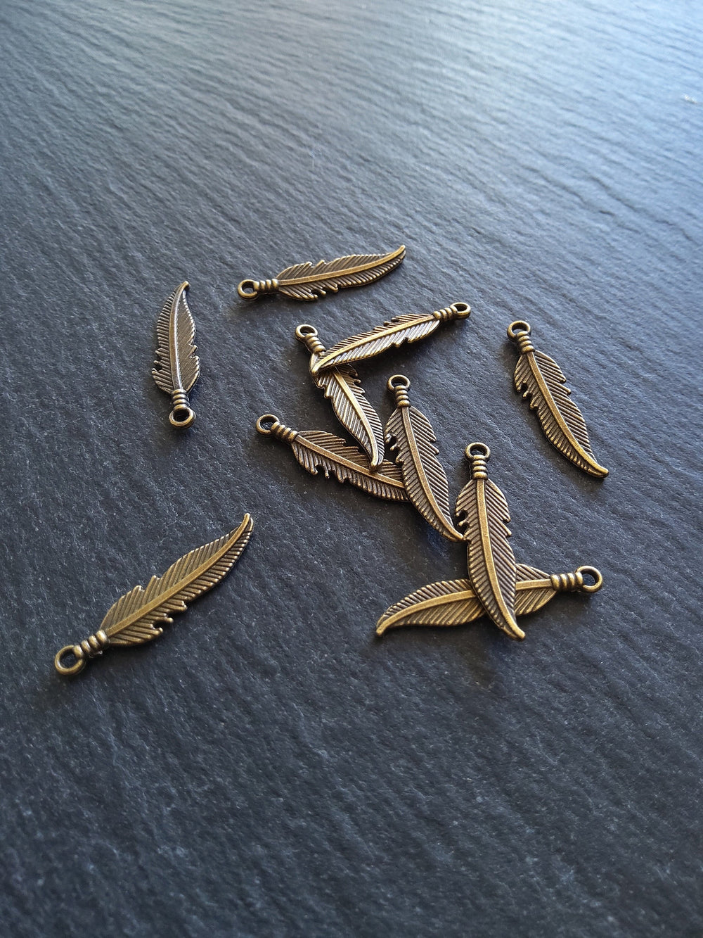 20 or 100 Antique Bronze Tone Feather Charms 27x6mm - ContentedCatz