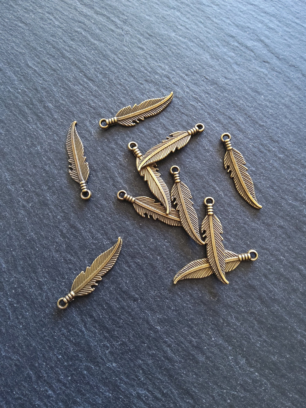20 or 100 Antique Bronze Tone Feather Charms 27x6mm - ContentedCatz