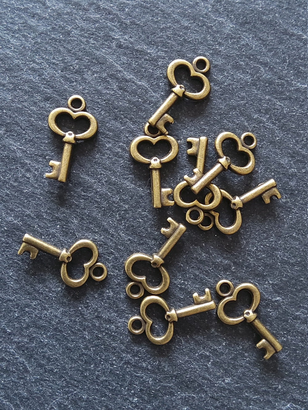 20 or 100 Cute Little Key Charms Antique Bronze Tone 15x9mm 2.5mm wide. Nickel FREE