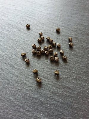 40 or 200 Bicone 5mm Antique Bronze Tone Striped Spacer Beads 5x4mm. Hole: 1mm - ContentedCatz