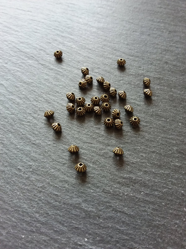 40 or 200 Bicone 5mm Antique Bronze Tone Striped Spacer Beads 5x4mm. Hole: 1mm - ContentedCatz