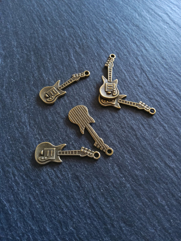 10 or 50 Guitar Charms Antique Bronze Tone 31x11x2mm