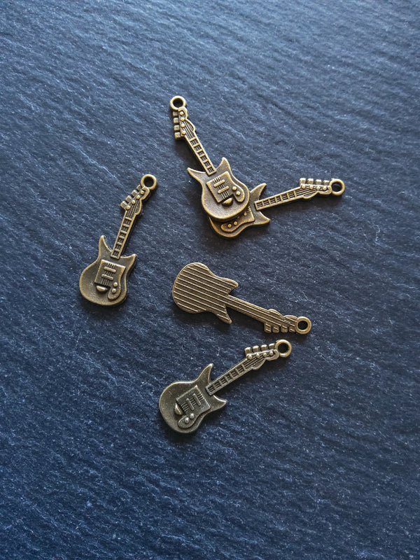 10 or 50 Guitar Charms Antique Bronze Tone 31x11x2mm