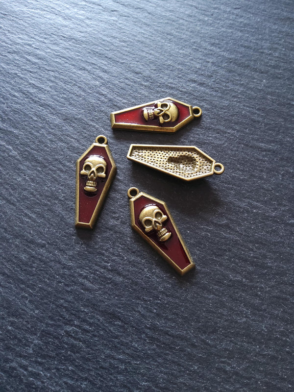 4 or 20 Coffin Shaped Antique Bronze Skull Charms with Red Enamel 32x13x4mm - ContentedCatz
