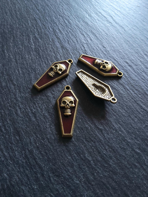 4 or 20 Coffin Shaped Antique Bronze Skull Charms with Red Enamel 32x13x4mm - ContentedCatz