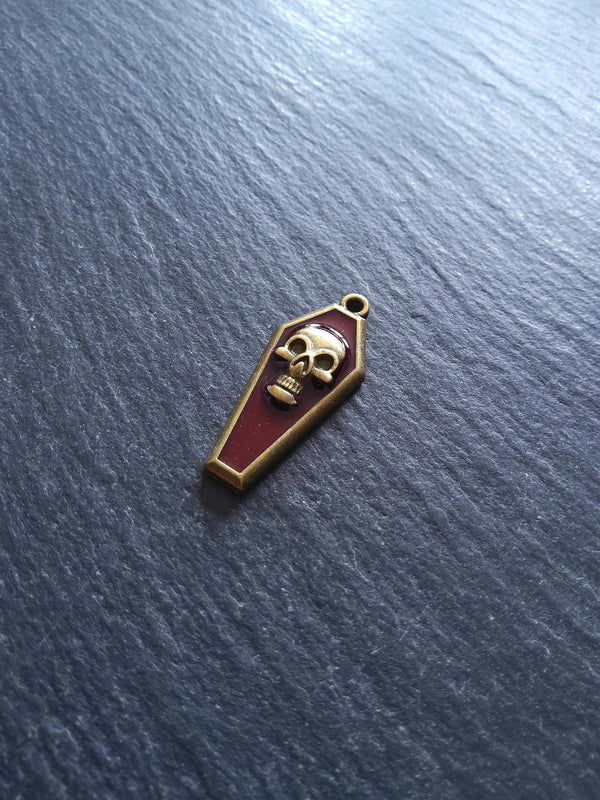 4 or 20 Coffin Shaped Antique Bronze Skull Charms with Red Enamel 32x13x4mm - ContentedCatz