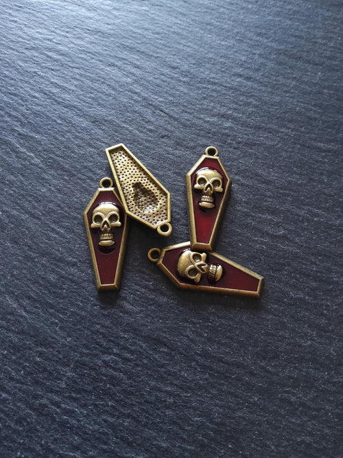 4 or 20 Coffin Shaped Antique Bronze Skull Charms with Red Enamel 32x13x4mm - ContentedCatz