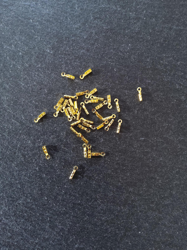 60 or 300 Gold Plated Brass Folding Crimp Ends 7.5x2.5mm For 1mm Cord. Hole: 1mm