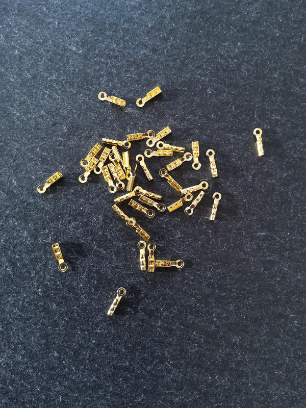 60 or 300 Gold Plated Brass Folding Crimp Ends 7.5x2.5mm For 1mm Cord. Hole: 1mm