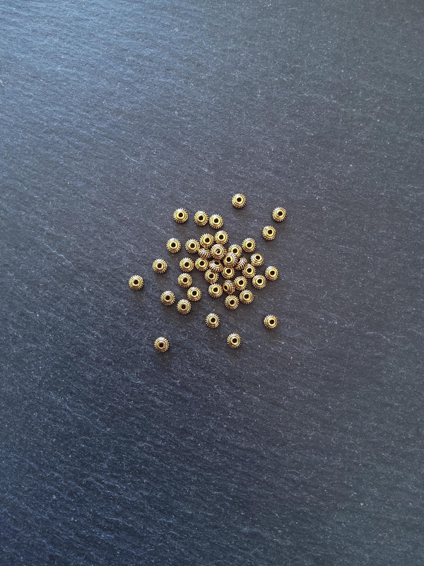 60 or 300 Antique Gold Tone 5mm Diameter Wheel Spacer Beads Bali Style 5x3mm Hole: 1mm