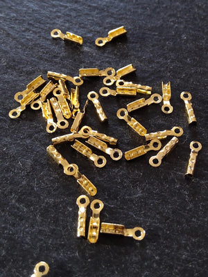 60 or 300 Gold Plated Brass Folding Crimp Ends 7.5x2.5mm For 1mm Cord. Hole: 1mm