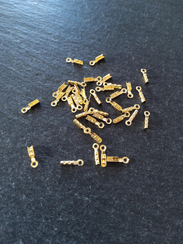 60 or 300 Gold Plated Brass Folding Crimp Ends 7.5x2.5mm For 1mm Cord. Hole: 1mm