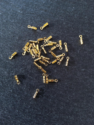 60 or 300 Gold Plated Brass Folding Crimp Ends 7.5x2.5mm For 1mm Cord. Hole: 1mm