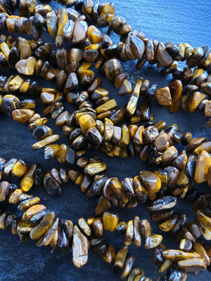 Natural Tigers Eye Rounded Chip Gemstone Beads. Long 80cm Strand. Approx. 5x10x3mm chips